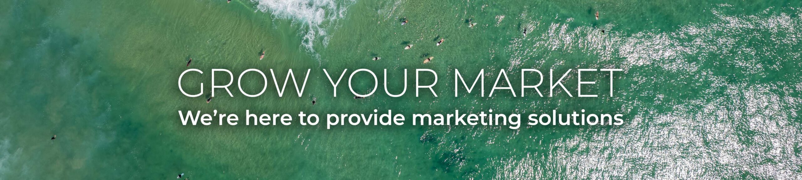 Top down drone view of tourists and surfers enjoying Fingal Head beach