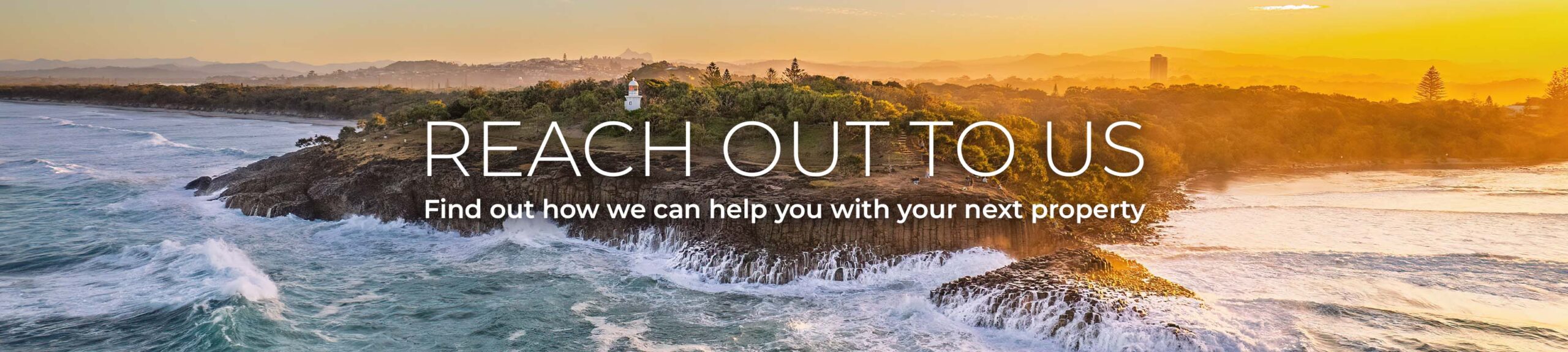 Elevated drone view of Fingal Head lighthouse at sunset